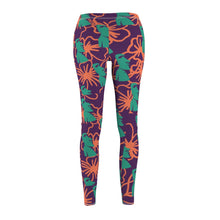 Load image into Gallery viewer, Tiki Flower Leggings with a dark purple background.  Orange outlined hibiscus flowers and teal green  Easter Island statue heads in a repeating pattern.
