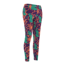 Load image into Gallery viewer, Tiki Flower Leggings with a dark purple background.  Orange outlined hibiscus flowers and teal green  Easter Island statue heads in a repeating pattern.
