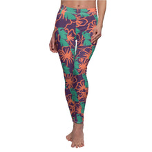 Load image into Gallery viewer, Tiki Flower Leggings with a dark purple background.  Orange outlined hibiscus flowers and teal green  Easter Island statue heads in a repeating pattern.
