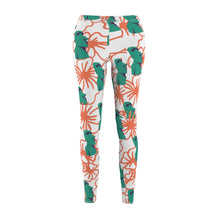 Load image into Gallery viewer, Tiki Flower Leggings with a white background.  Orange outlined hibiscus flowers and teal green  Easter Island statue heads in a repeating pattern.
