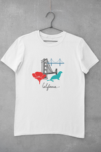 Load image into Gallery viewer, Short sleeve cotton T-Shirt for both men and women and offered in 5 great colors.  This comfy t-shirt combines all the iconic San Fran elements.  The golden gate bridge, seals, poppies, and the Cali spirit all in one beautiful design.  Perfect for a SF lover, California fan. 
