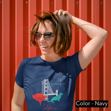 Load image into Gallery viewer, Short sleeve cotton T-Shirt for both men and women and offered in 5 great colors.  This comfy t-shirt combines all the iconic San Fran elements.  The golden gate bridge, seals, poppies, and the Cali spirit all in one beautiful design.  Perfect for a SF lover, California fan. 
